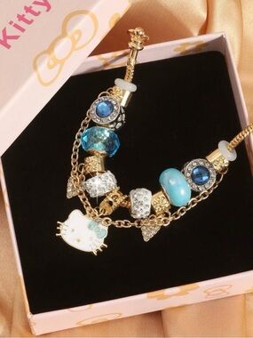 Hello Kitty Gold Bracelet with Blue and White Charms
